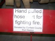 Hand pulled hose cart sign
